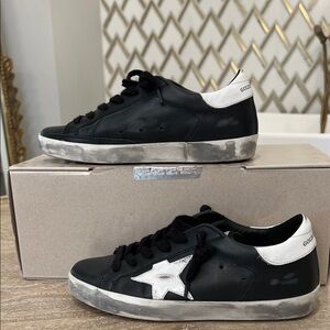 Golden Goose Woman’s Sneakers in Black with White Star